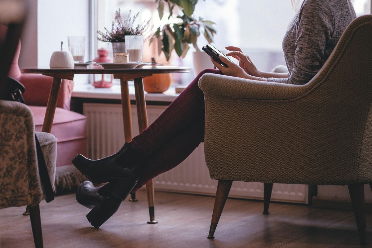 Woman sitting comfortably using a tablet device
